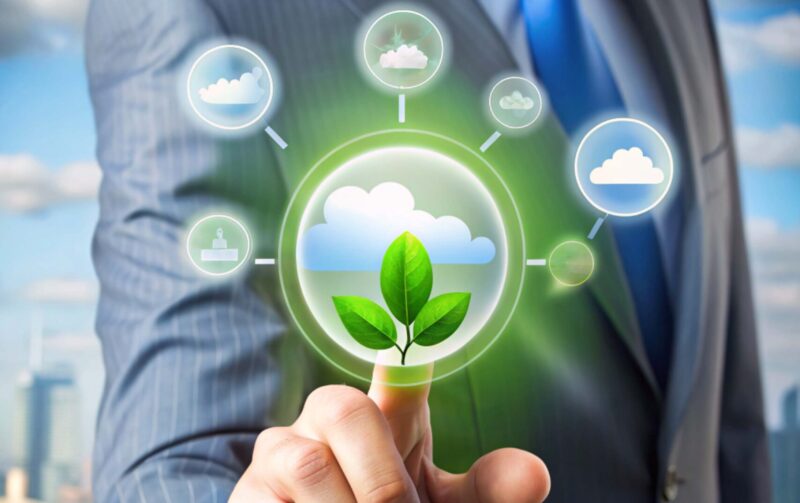 Businessman touching icon of CO2 depicting the issue and reduce CO2 emissions carbon on business working